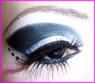   goth white and pressed powder foundation, liquid eyeliner and false