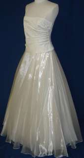   dress ball gown the color is ivory the dress is made from satin bodice