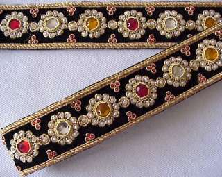 Renaissance style medallions adorn this black velvet trim. Red, gold 