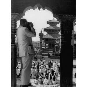  Tourist in Nepal Taking a Picture of a Temple Photographic 