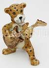 figurine animal ceramic statue cheetah playing guitar  