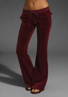 JUICY COUTURE Velour Flared Leg Pant with Snap Pockets in Dark Crimson 