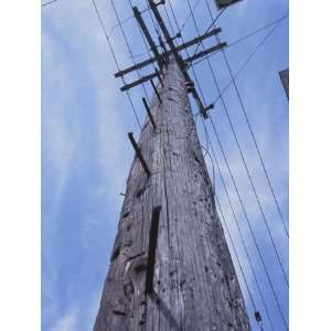  View of Electrical Lines on Wooden Utility Pole Against 